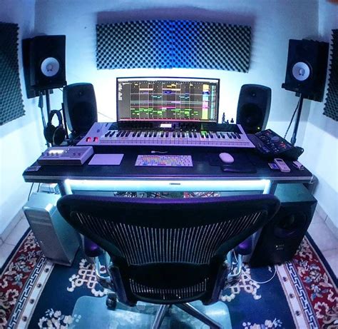 EDM studio with lights, a white midi keyboard and nice desk ...