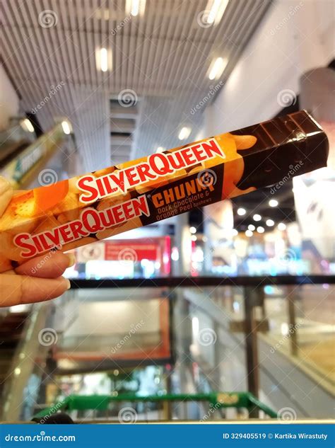 Jakarta, Indonesia - July 30,2024: a Person Holding a Silver Queen ...