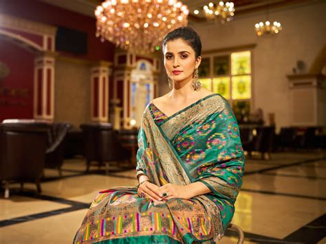 Firozi Regal Kanjeevaram Organza Saree with Zari Woven Borde