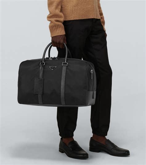 Re-Nylon and Saffiano leather duffel bag in black - Prada | Mytheresa