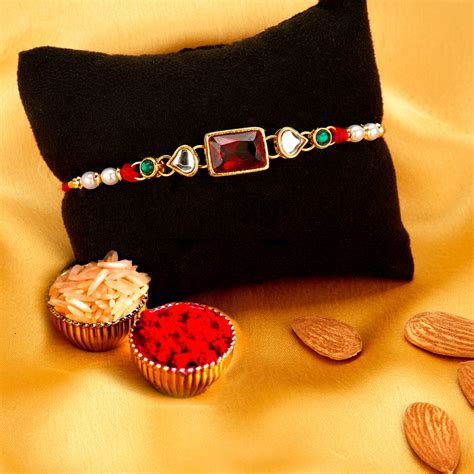 Sukkhi Amazing Gold Plated Rakhi with Roli Chawal and Raksha Bandhan G