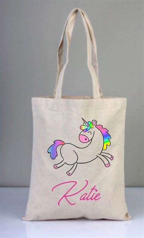 a white bag with a unicorn on it and the word rate written in pink ink