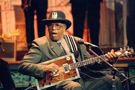 Download Bo Diddley Singing With Guitar Wallpaper | Wallpapers.com