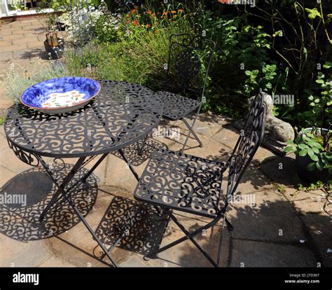 Wrought iron garden furniture hi-res stock photography and images - Alamy