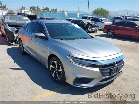 Report 19XZE4F54NE017398 HONDA INSIGHT 2022 Silver Hybrid - price and damage history