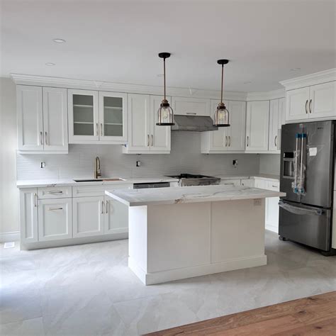 Modern White Kitchen With Stainless Steel Appliances