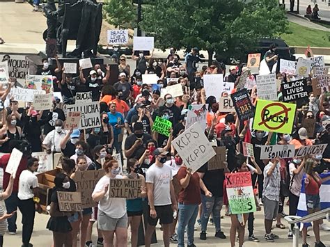 Hundreds of protesters march to steps of City Hall with list of changes ...