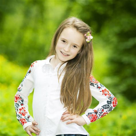 Portrait of Agirl in the Park on a Background of Green Trees Stock ...