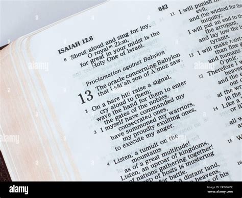 Open Holy Bible Book, prophet Isaiah prophecy for the fall of Babylon ...