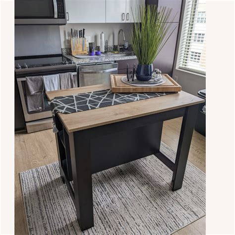 Wayfair Cala 3-Shelf Wooden Casual Kitchen Island - AptDeco