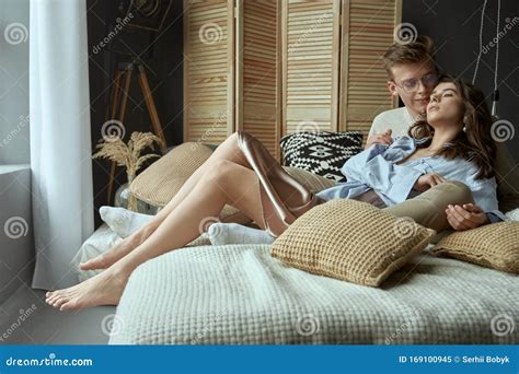 Happy Young Couple Hugging on Bed. Stock Image - Image of pillows ...