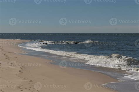 This is Sunset Beach at Cape May New Jersey. The beautiful sand lays ...