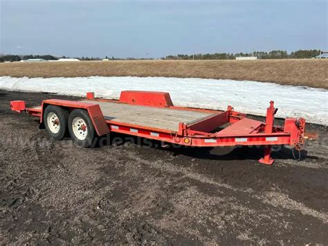 1996 Red Towmaster skid loader trailer | GovDeals