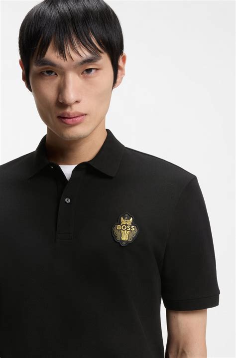 BOSS - Year of the Horse Cotton-piqué polo shirt with logo artwork - Black
