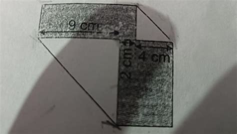 3. Two corners of a napkin are folded as shown. Find the area of the ...