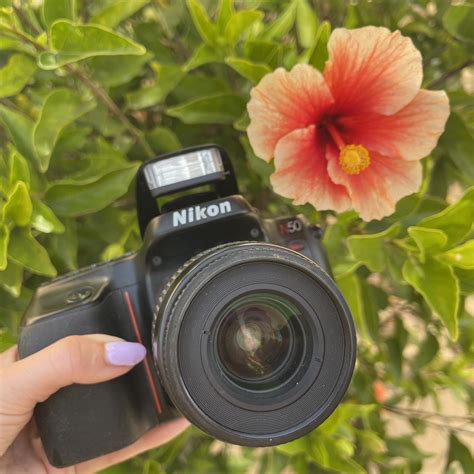 This Nikon N50 film camera is a reliable and... - Depop