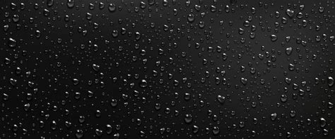 Condensation water drops on black window background. rain droplets with ...