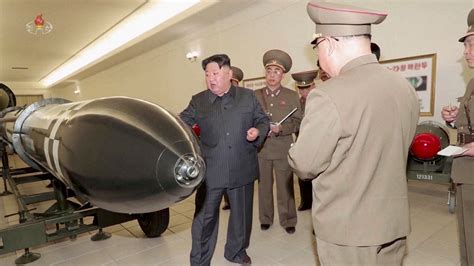 North Korea's Kim calls for more 'practical, offensive' war deterrence | Reuters