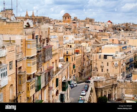 Valletta street scene with balconies hi-res stock photography and ...
