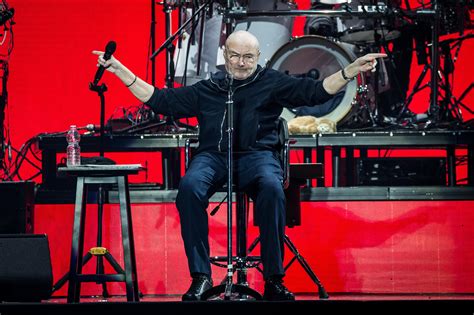 Phil Collins suffers fall on stage and resorts to wheelchair