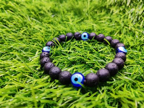 Black Lava Stone and Evil Eye Bracelet — Parthpooja