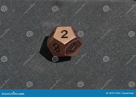 Copper Metallic D12 Twelve Sided Dice on Foam Surface Stock Image ...
