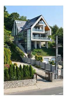 House On A Slope by A House On A Slope Connects To Its Surroundings Through A House On A Slope