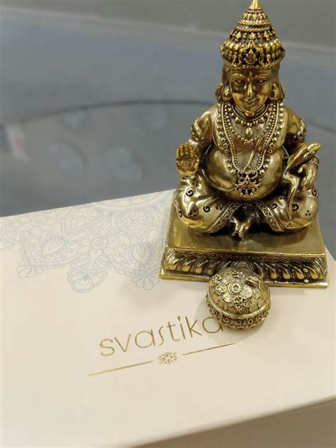 Brass Lord Kubera Statue with Mongoose (4 Inches)