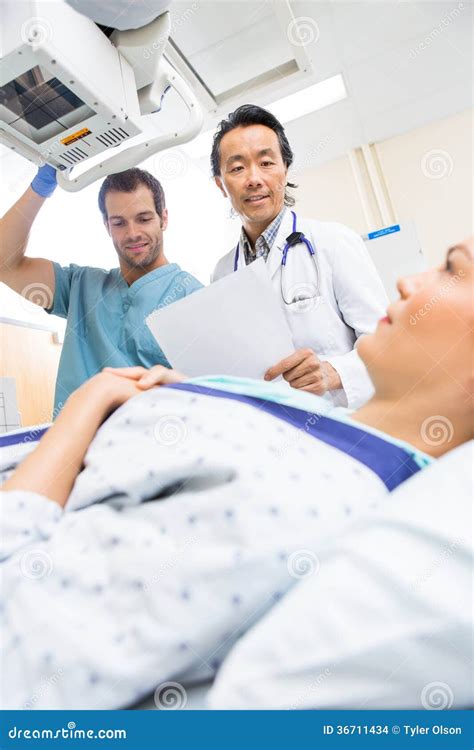 Medical Team Preparing Patient in Xray Room Stock Photo - Image of care ...