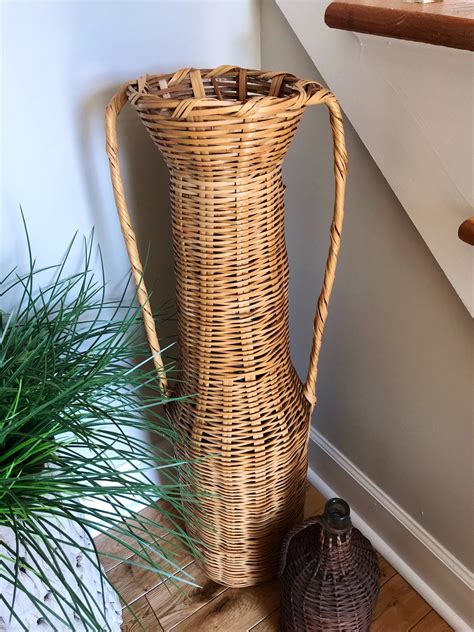 Tall Woven Rattan Floor Vase at Joyce Collins blog
