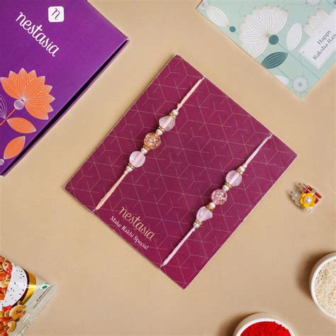 Peach and Pink Rakhi Set Of 2 Online - Premium Gift Hamper | Nestasia
