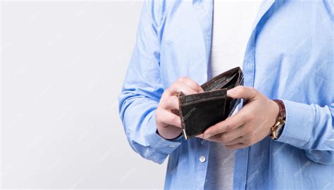 Premium Photo | Closeup of broke man with wallet isolated on studio ...