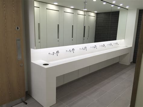 Corian trough style vanities | Modern restroom design, Bathroom design ...