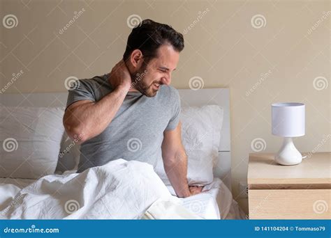 Man Feeling Neck Ache after Sleeping in Bed Stock Photo - Image of injured, portrait: 141104204