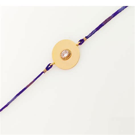 Gold Plated Modern Rakhi with crystal and blue thread – Suhani Pittie