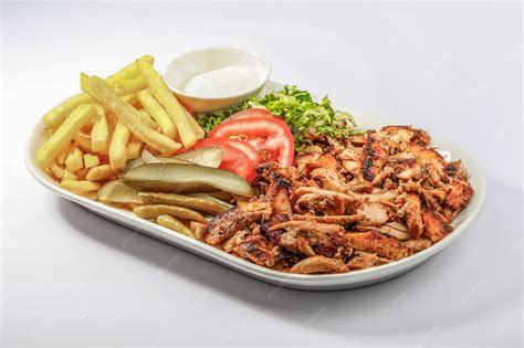 Premium Photo | Chicken Shawarma plate with salad fries served in a ...