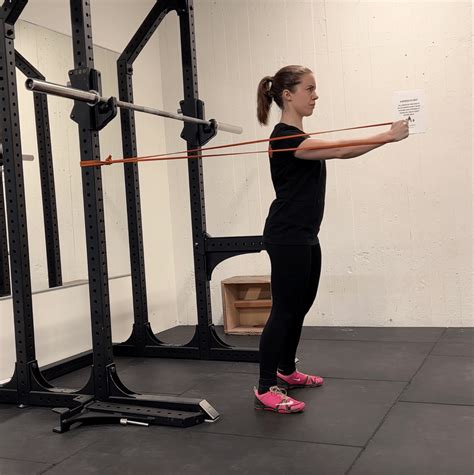How to Do Standing Resistance Band Chest Fly: Muscles Worked & Proper ...