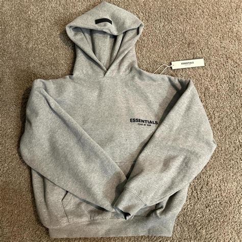 Grey Essentials hoodie - Depop