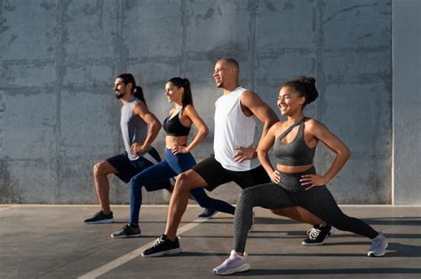 Group of people exercising together outdoors | Free Photo