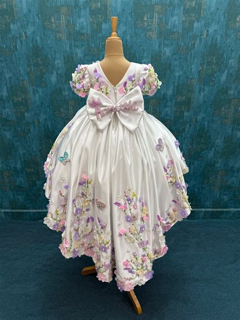 mind blowing white floral ball gown with attached trail with intricate