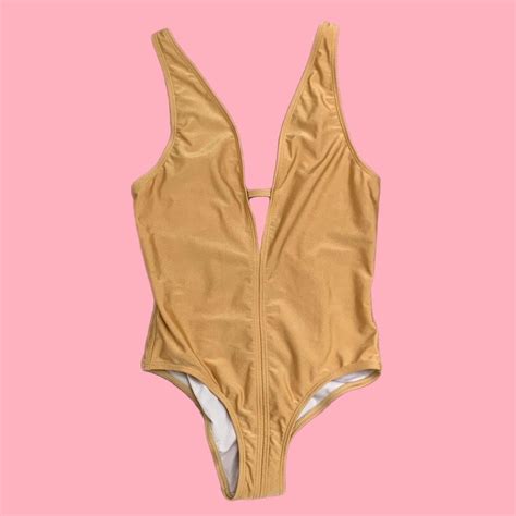 Low cut gold swim suit In good condition Would... | Depop