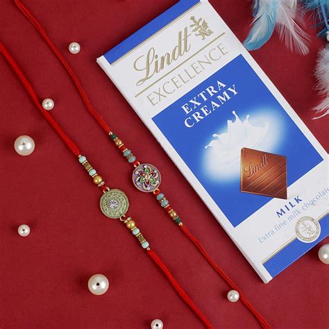 Send Two Rakhi Set With Lindt Chocolate Bar Online | Rakhibazaar.com