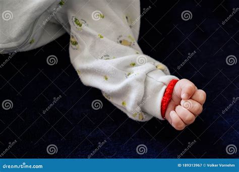 Detail of a Hand of a Sleeping Infant Clenched into a Fist Stock Image ...