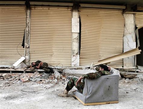 SYRIA-DARAYA-REBELS' EVACUATION-SYRIAN SOLDIERS-FEATURE