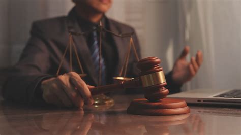 justice and law concept.Male judge in a courtroom on wooden table and ...