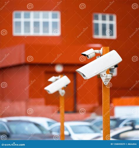 Surveillance Cameras in the Parking Lot. Stock Image - Image of observe ...