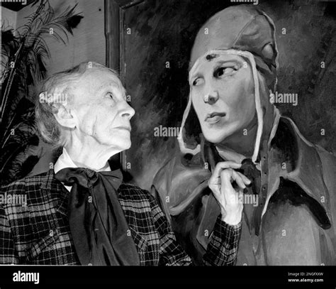 Amy Otis Earhart, 79, looks at a portrait of her daughter, aviatrix ...