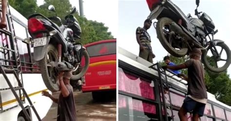 Man Climbs Bus Ladder While Balancing A Motorbike On His Head