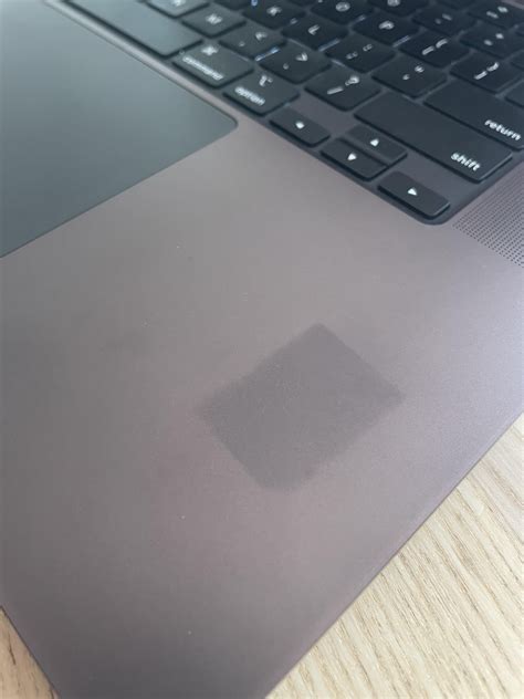 Discoloration in the shape of an SD card. : r/macbookpro