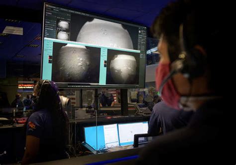 One of the six wheels aboard NASA's Perseverance Mars rover is seen in ...